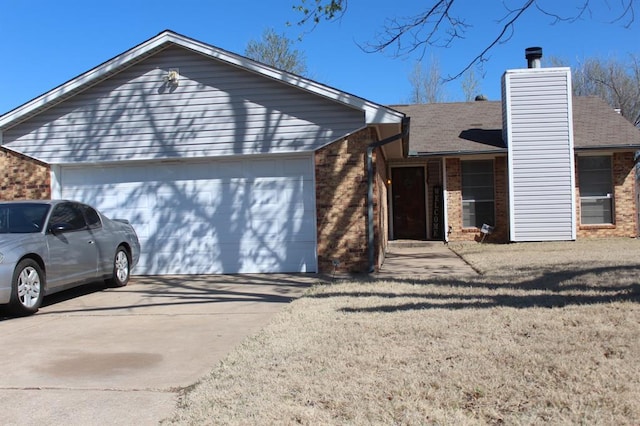 9607 NE 3rd Pl, Midwest City, OK 73130 - ranch-style house featuring brick siding, a garage, driveway, and a chimney