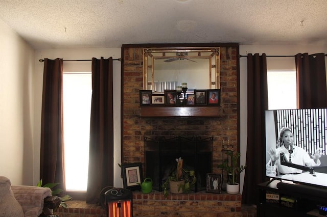 9607 NE 3rd Pl, Midwest City, OK 73130 - living area with a textured ceiling and a brick fireplace