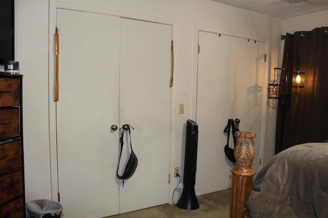 9607 NE 3rd Pl, Midwest City, OK 73130 - bedroom featuring concrete flooring and two closets