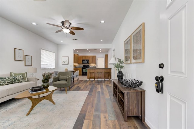 825 Elm Ave, Yukon, OK 73099 - living area featuring a ceiling fan, wood finished floors, and recessed lighting