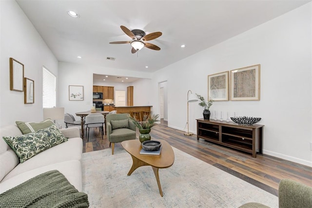 825 Elm Ave, Yukon, OK 73099 - living area with ceiling fan, wood finished floors, and recessed lighting