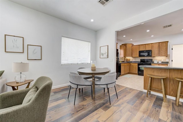 825 Elm Ave, Yukon, OK 73099 - dining area with recessed lighting and light wood-type flooring