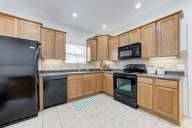 825 Elm Ave, Yukon, OK 73099 - kitchen featuring black appliances, dark countertops, backsplash, recessed lighting, and light tile patterned floors