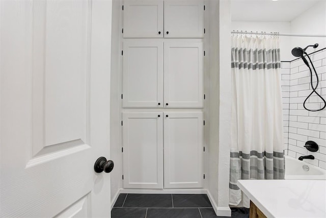 825 Elm Ave, Yukon, OK 73099 - bathroom with tile patterned floors, shower / bath combo with shower curtain, and vanity