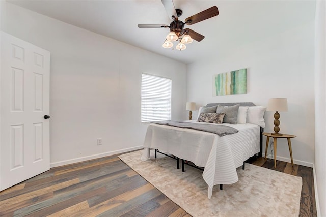 825 Elm Ave, Yukon, OK 73099 - bedroom with dark wood-type flooring and ceiling fan