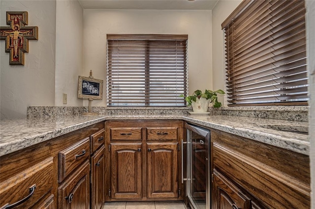1504 Canary Pl, Edmond, OK 73034 - kitchen featuring beverage cooler and light stone counters