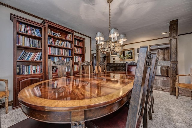 1504 Canary Pl, Edmond, OK 73034 - dining space featuring carpet, a chandelier, and crown molding