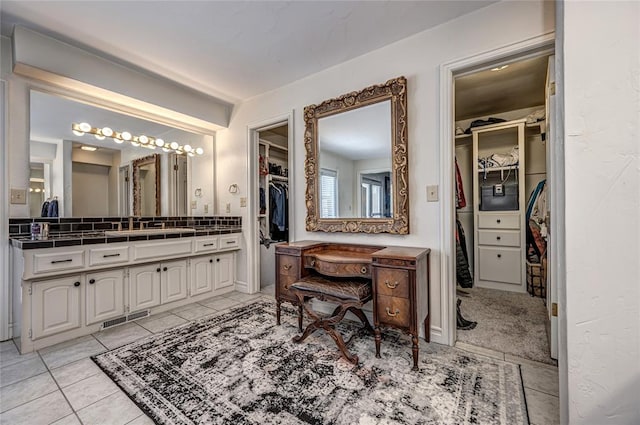 1504 Canary Pl, Edmond, OK 73034 - full bathroom featuring vanity, a spacious closet, and tile patterned flooring