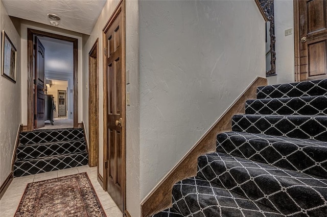 1504 Canary Pl, Edmond, OK 73034 - stairway featuring a textured wall and baseboards