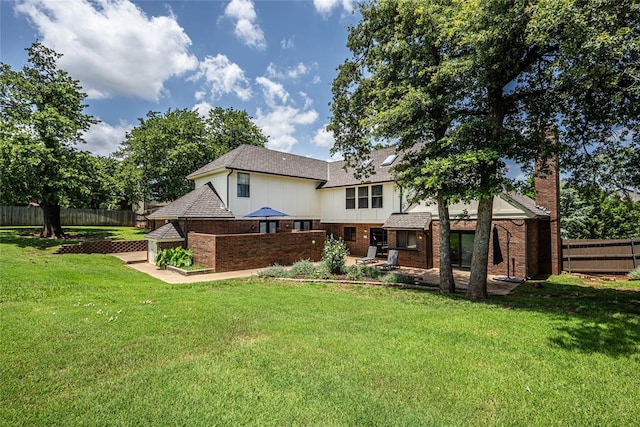 1504 Canary Pl, Edmond, OK 73034 - back of house with brick siding, a fenced backyard, a chimney, and a patio area