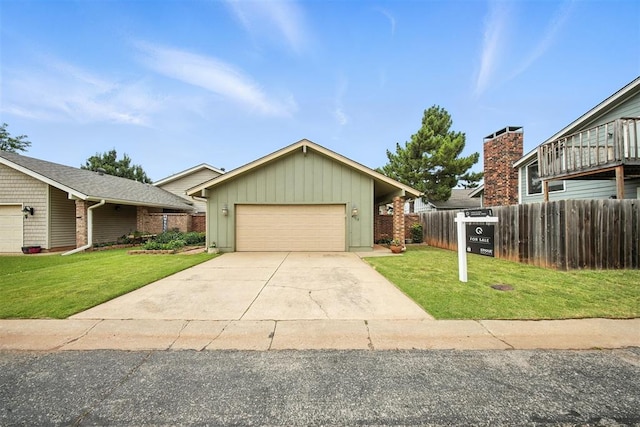 4713 N Cypress Ct, Oklahoma City, OK 73162 - view of front facade featuring board and batten siding, a garage, and driveway