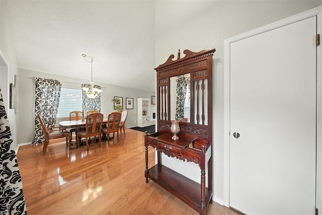 4713 N Cypress Ct, Oklahoma City, OK 73162 - dining space with light wood-style floors and a chandelier