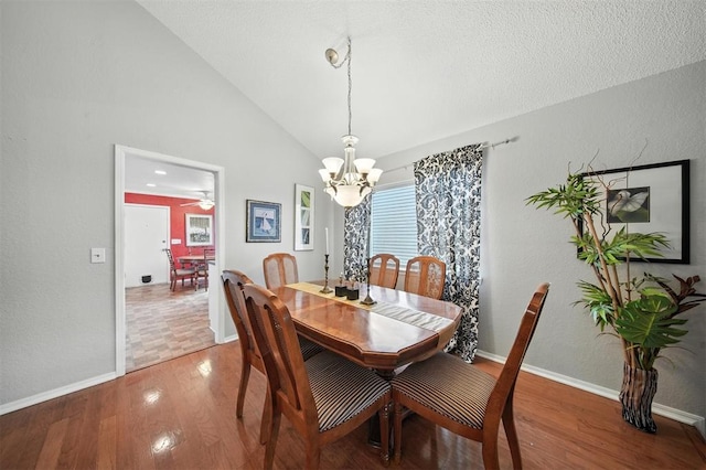 4713 N Cypress Ct, Oklahoma City, OK 73162 - dining room with a chandelier, wood finished floors, and high vaulted ceiling