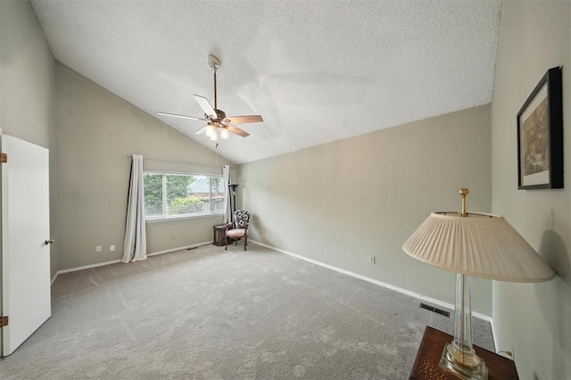 4713 N Cypress Ct, Oklahoma City, OK 73162 - spare room with a ceiling fan, carpet flooring, vaulted ceiling, and a textured ceiling