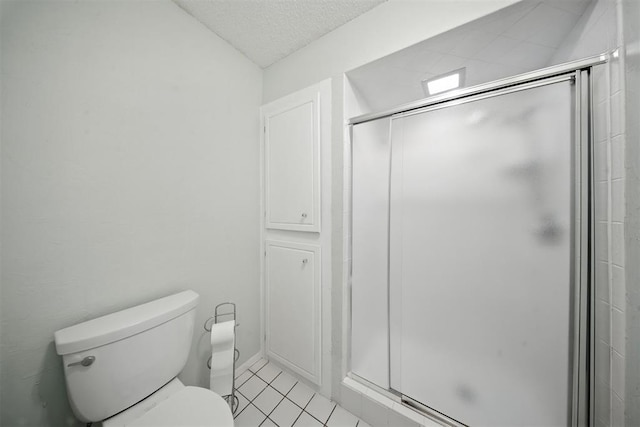 4713 N Cypress Ct, Oklahoma City, OK 73162 - bathroom with a shower stall, tile patterned floors, and a textured ceiling