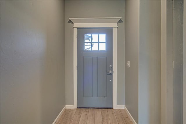 3800 Palmetto Trl, Oklahoma City, OK 73179 - doorway to outside featuring light wood-style floors and baseboards