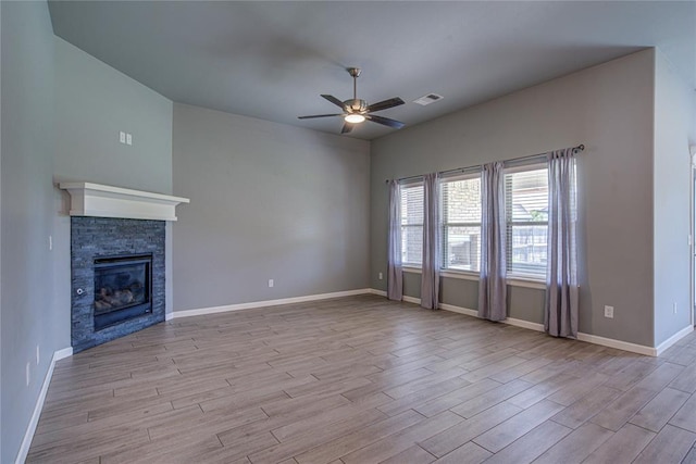 3800 Palmetto Trl, Oklahoma City, OK 73179 - unfurnished living room featuring ceiling fan, wood finished floors, and a fireplace