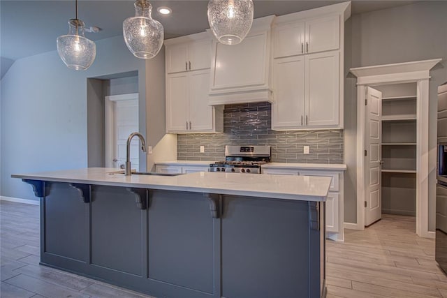 3800 Palmetto Trl, Oklahoma City, OK 73179 - kitchen featuring stainless steel stove, light wood finished floors, decorative backsplash, white cabinets, and recessed lighting