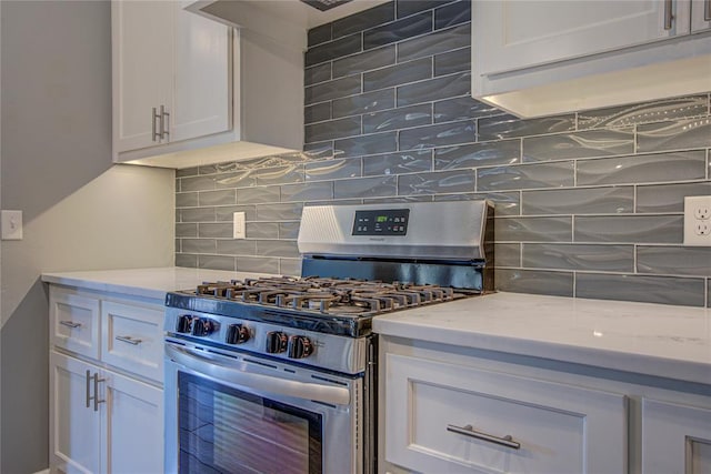 3800 Palmetto Trl, Oklahoma City, OK 73179 - kitchen with gas range, backsplash, white cabinets, and light stone countertops
