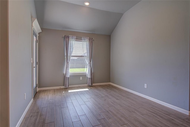 3800 Palmetto Trl, Oklahoma City, OK 73179 - empty room with vaulted ceiling and wood finished floors
