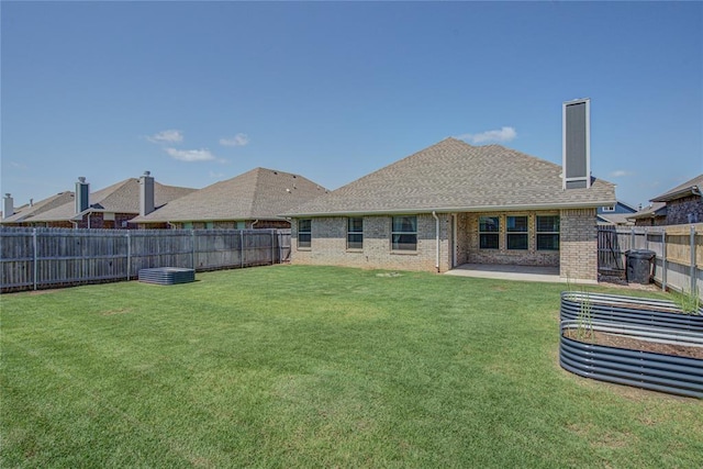 3800 Palmetto Trl, Oklahoma City, OK 73179 - back of house featuring brick siding, a fenced backyard, a chimney, a shingled roof, and a patio
