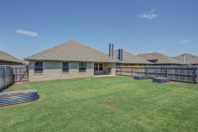 3800 Palmetto Trl, Oklahoma City, OK 73179 - back of house featuring a fenced backyard, a chimney, brick siding, and a shingled roof