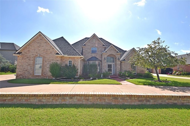 12608 Redstone Ct, Oklahoma City, OK 73142 - view of front of house featuring brick siding and a front yard