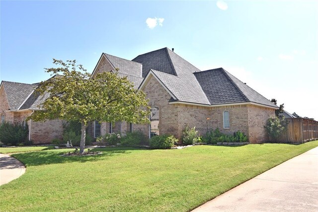12608 Redstone Ct, Oklahoma City, OK 73142 - french country inspired facade featuring brick siding