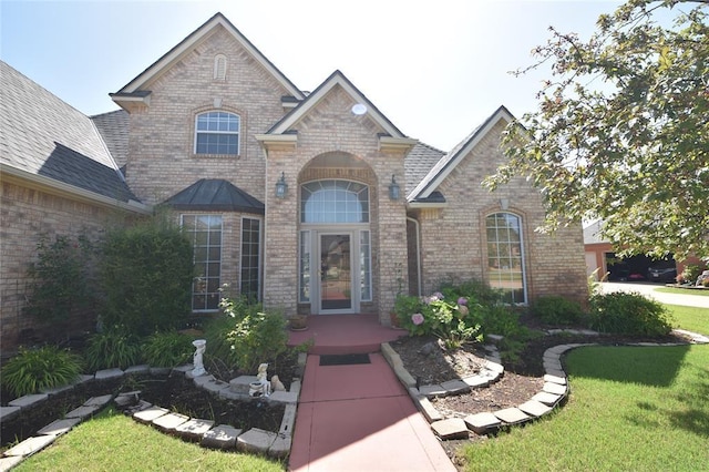 12608 Redstone Ct, Oklahoma City, OK 73142 - french provincial home featuring brick siding and a front lawn
