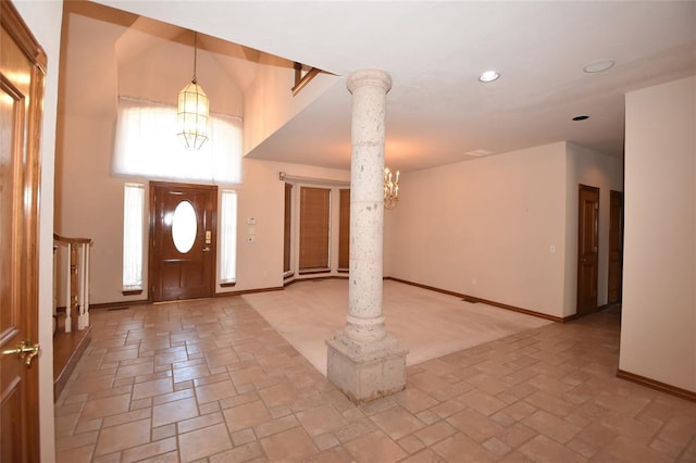 12608 Redstone Ct, Oklahoma City, OK 73142 - entrance foyer with a chandelier, decorative columns, and recessed lighting