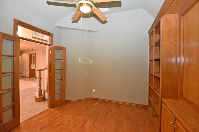 12608 Redstone Ct, Oklahoma City, OK 73142 - spare room featuring french doors, lofted ceiling, light wood-style floors, and ceiling fan