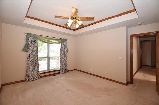 12608 Redstone Ct, Oklahoma City, OK 73142 - unfurnished room featuring a raised ceiling, light colored carpet, and ornamental molding