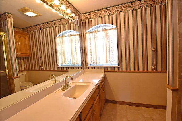 12608 Redstone Ct, Oklahoma City, OK 73142 - bathroom with wallpapered walls, vanity, a shower with door, and tile patterned floors