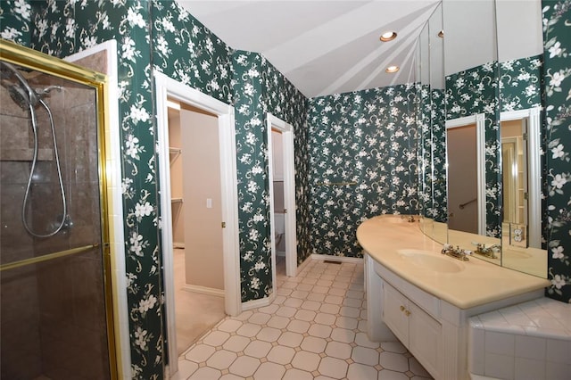 12608 Redstone Ct, Oklahoma City, OK 73142 - bathroom featuring wallpapered walls, a shower stall, vanity, and vaulted ceiling