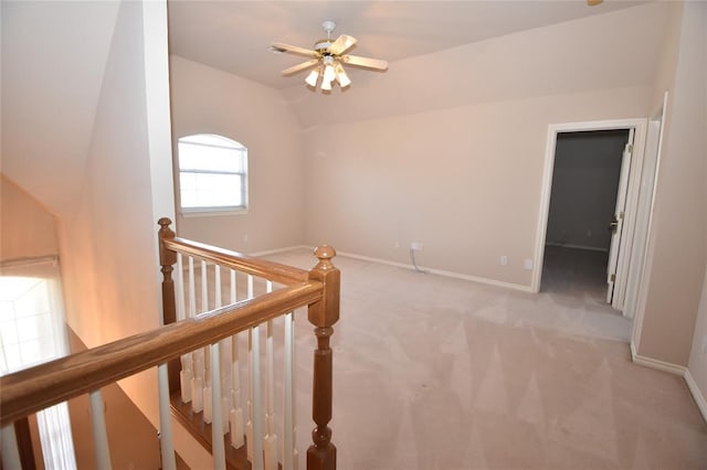 12608 Redstone Ct, Oklahoma City, OK 73142 - hallway with an upstairs landing, light colored carpet, and vaulted ceiling