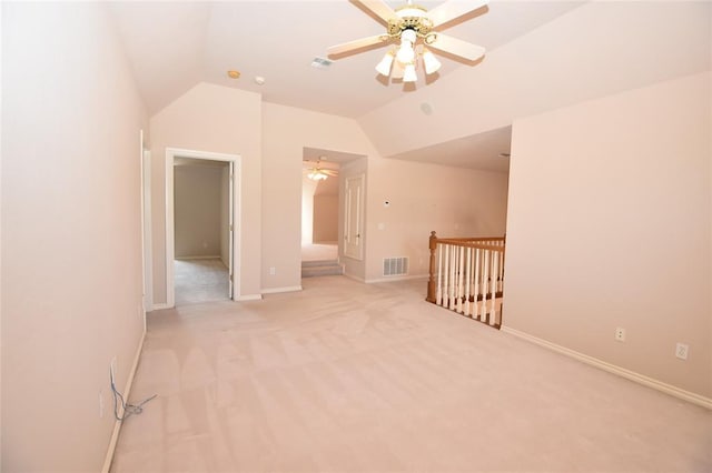 12608 Redstone Ct, Oklahoma City, OK 73142 - spare room featuring vaulted ceiling, a ceiling fan, and light carpet