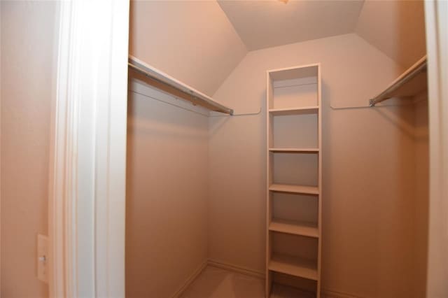 12608 Redstone Ct, Oklahoma City, OK 73142 - spacious closet featuring vaulted ceiling