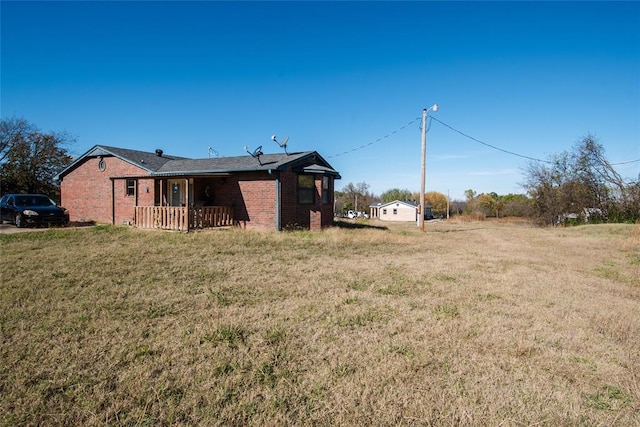 23281 N Pvt 3227 Dr, Pauls Valley, OK 73075 - rear view of property with brick siding and a lawn