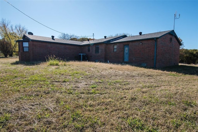 23281 N Pvt 3227 Dr, Pauls Valley, OK 73075 - rear view of property with brick siding and a lawn