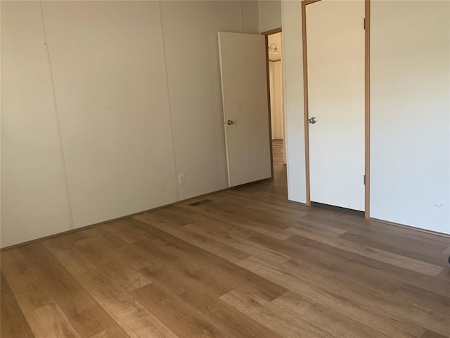 128 N Buffalo St, Canadian, OK 74425 - unfurnished bedroom featuring wood finished floors