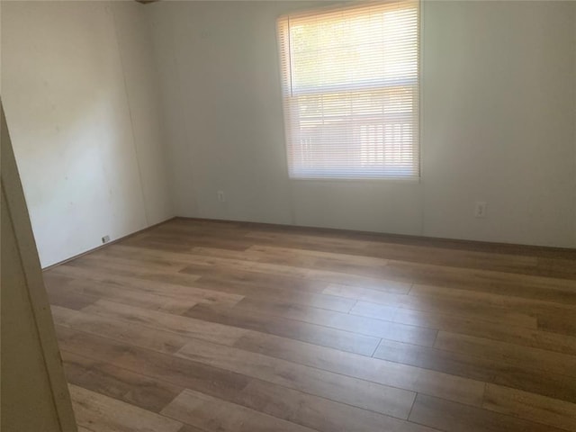 128 N Buffalo St, Canadian, OK 74425 - unfurnished room with wood finished floors