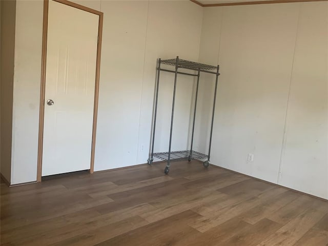 128 N Buffalo St, Canadian, OK 74425 - unfurnished bedroom featuring wood finished floors