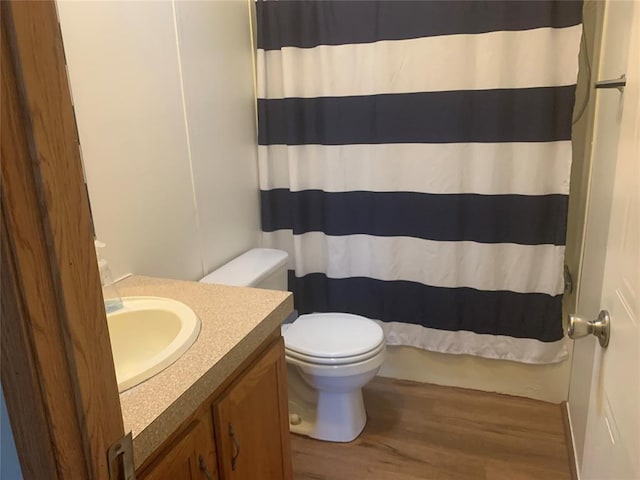 128 N Buffalo St, Canadian, OK 74425 - bathroom with wood finished floors, vanity, and curtained shower