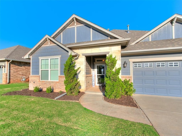 1417 Atalon Dr, Moore, OK 73160 - view of front facade with a front lawn, concrete driveway, an attached garage, stone siding, and brick siding