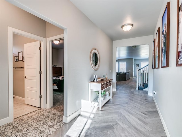 1417 Atalon Dr, Moore, OK 73160 - hallway featuring baseboards and stairs