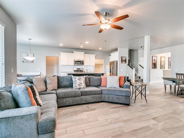 1417 Atalon Dr, Moore, OK 73160 - living room featuring ceiling fan, stairway, and recessed lighting