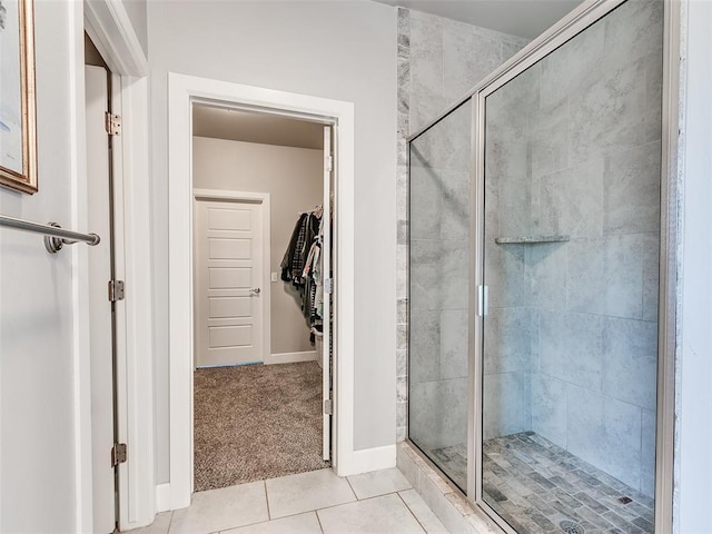 1417 Atalon Dr, Moore, OK 73160 - full bathroom featuring a stall shower, a walk in closet, and tile patterned floors
