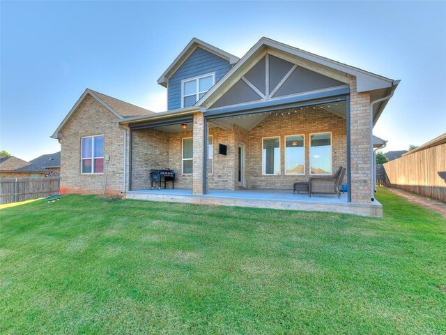 1417 Atalon Dr, Moore, OK 73160 - back of house featuring a fenced backyard, a patio area, and brick siding