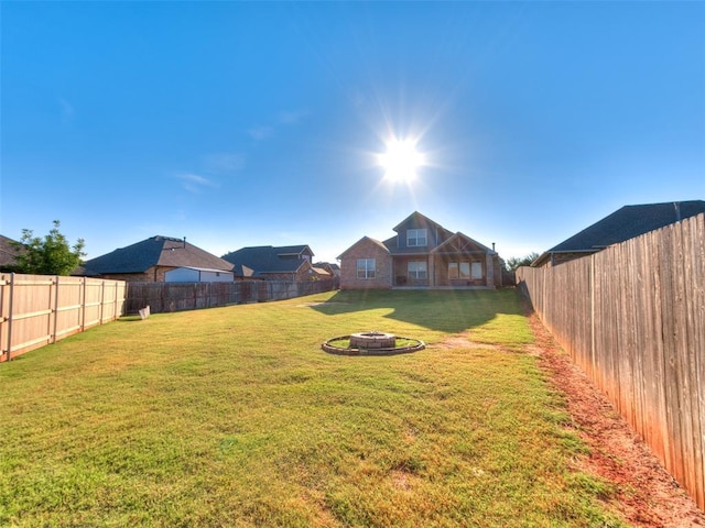 1417 Atalon Dr, Moore, OK 73160 - fenced backyard featuring an outdoor fire pit