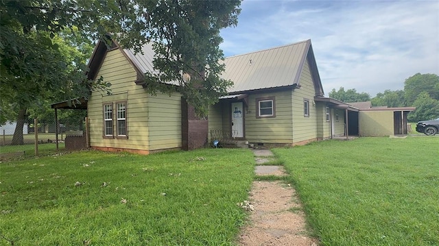 201 S Oak St, Pauls Valley, OK 73075 - view of front of home featuring a front yard and a metal roof